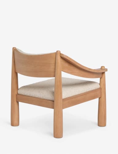A modern armchair with a solid wood frame and upholstered seat and backrest. The frame features rounded, tapered legs and armrests, with curved supports for the back. The upholstery appears to be a textured boucle fabric. — 3D model
