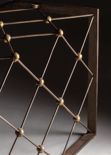 A rectangular coffee table with a glass top and a metal base. The base features a crisscross pattern of thin metal rods with spherical brass accents at each intersection. The legs are simple, straight forms that support the rectangular frame. — 3D model