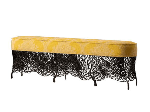 A long, upholstered bench with a textured yellow fabric seat featuring a pattern. The base is constructed from dark, intricately woven metal that mimics organic forms, possibly resembling branches or roots, and terminates in short, decorative legs. — 3D model