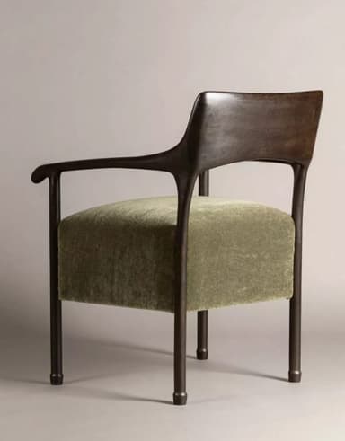 A contemporary lounge chair featuring a dark, sculpted wooden frame and an upholstered seat in olive green velvet. The chair has integrated armrests and a curved backrest, presenting an organic modern aesthetic. — 3D model