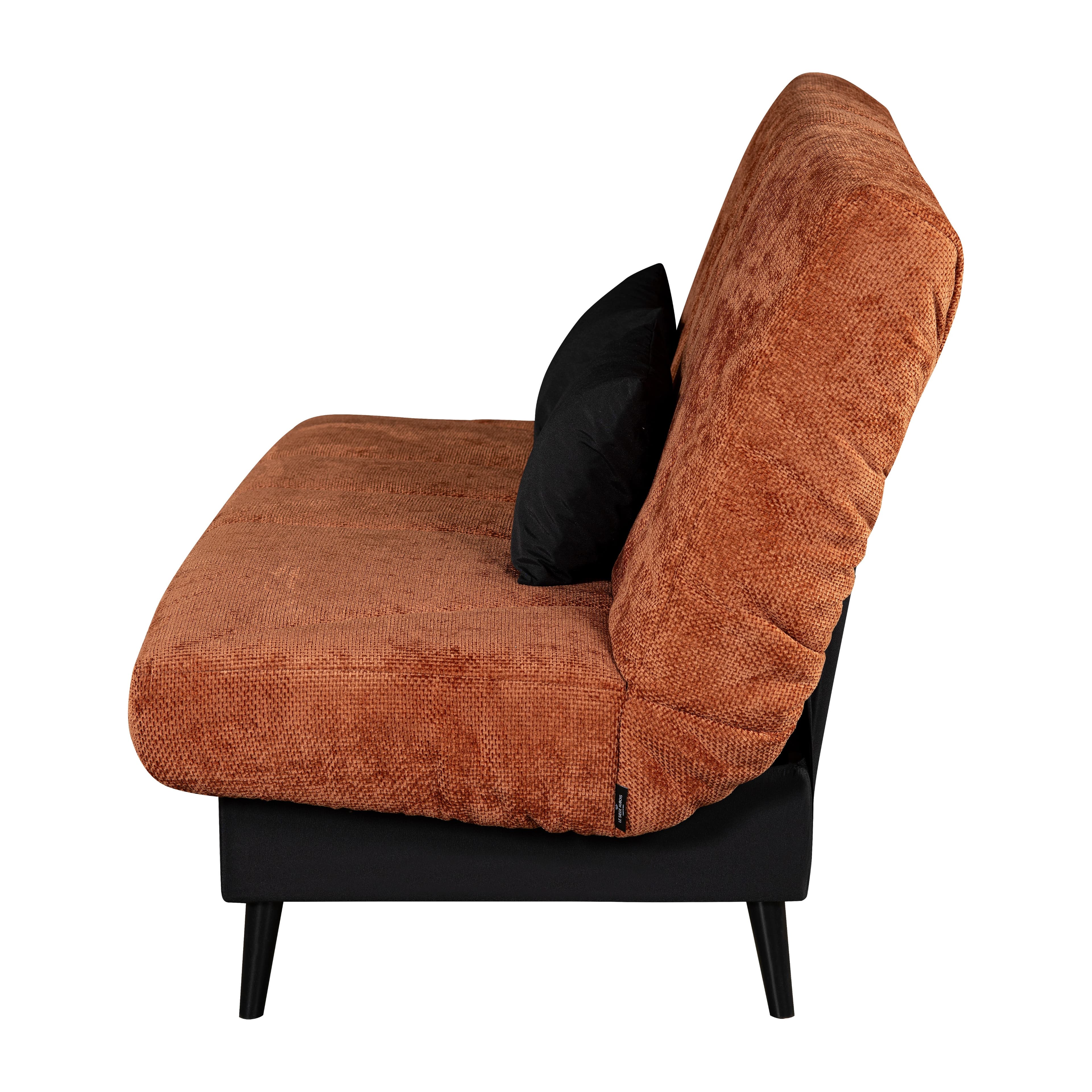 A modern sofa bed, viewed from a side profile, upholstered in a vibrant orange, textured fabric. The backrest is shown in a reclined position, indicative of its convertible functionality. It features a minimalist design with a black lower frame and four black, tapered, splayed legs. A single black throw pillow rests against the backrest, providing a contrast to the orange upholstery. — 3D model
