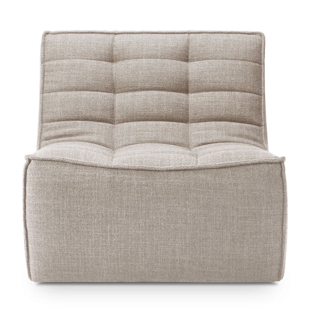 A low-profile, modular lounge chair element upholstered in a light beige textured fabric, featuring tufted back and seat cushions, designed for relaxed seating. — 3D model