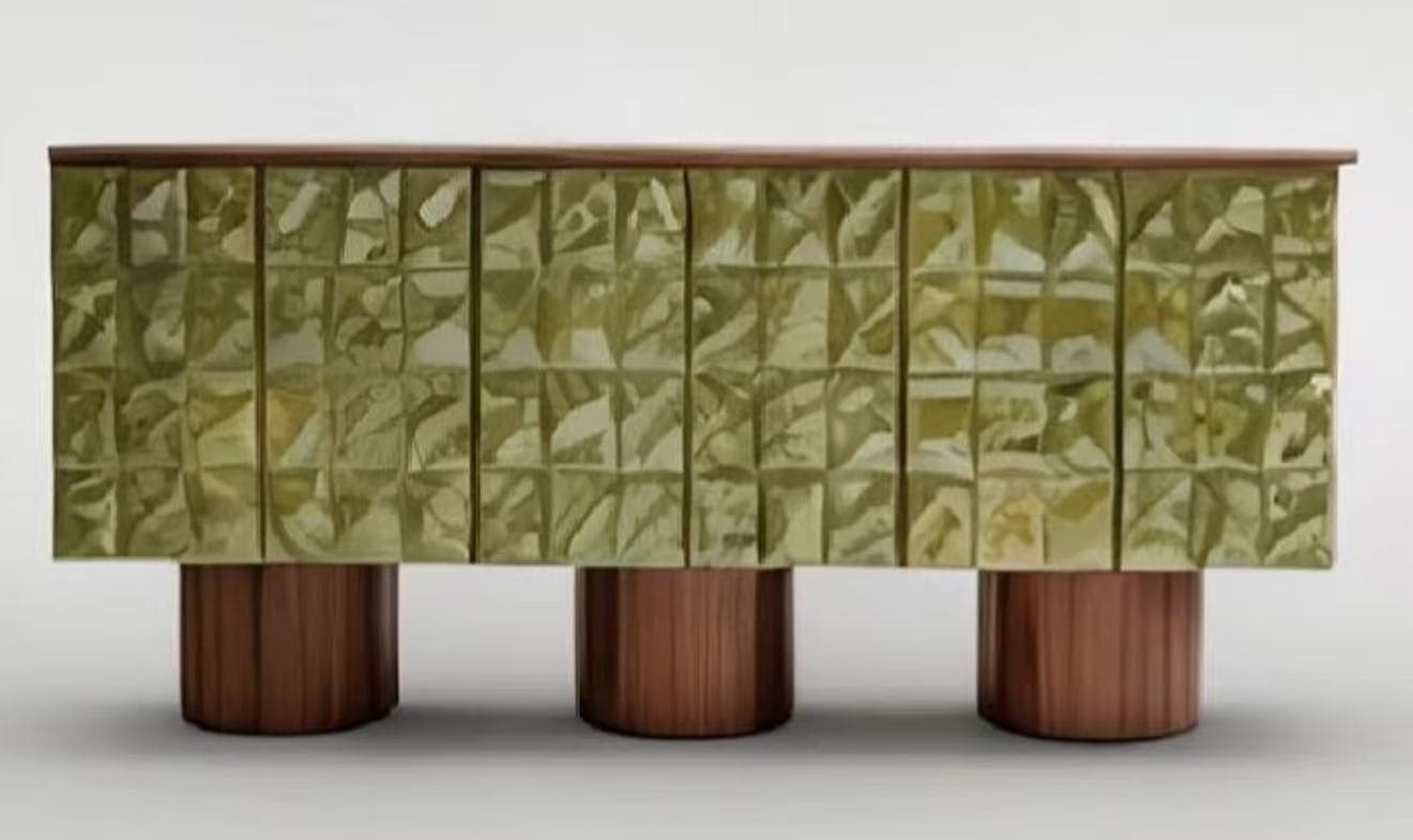 A modern sideboard with a textured, geometric front panel and cylindrical wooden legs. — 3D model