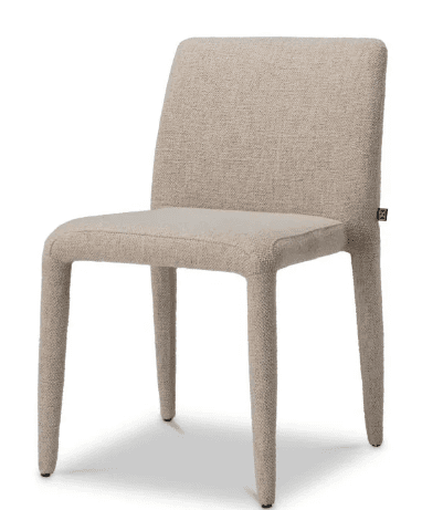 An armless dining chair featuring a fully upholstered design, where both the seat and backrest, as well as the legs, are covered in the same textured, light-colored fabric. The chair exhibits a minimalist and contemporary aesthetic with clean lines and a seamless appearance. A small dark tag is visible on the upper right side of the backrest. — 3D model