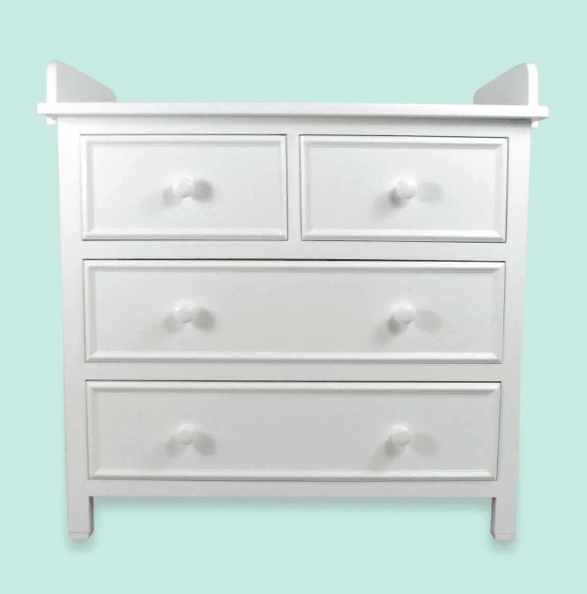 A white dresser featuring a total of four drawers, with two smaller drawers positioned above two larger, full-width drawers. The top surface is designed with raised edges on the back and sides, indicating its function as a changing table for a nursery. — 3D model