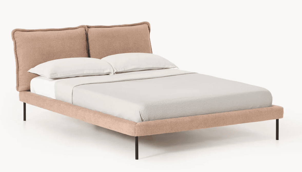 A modern platform bed featuring a soft, pillowy upholstered headboard and a matching upholstered frame, supported by slim black metal legs. — 3D model