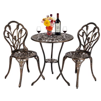 A three-piece outdoor bistro set featuring a round table and two chairs, all crafted from ornate bronze-finished cast aluminum with intricate floral and scrollwork designs. — 3D model