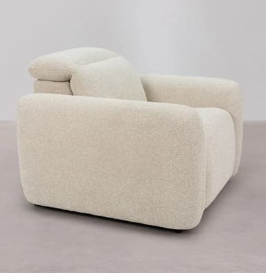 A modern armchair with a plush, upholstered design. It features rounded arms and a generously padded seat and backrest, suggesting comfort and contemporary style. The fabric has a textured, bouclé-like weave. — 3D model