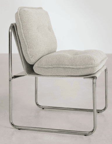 A modern armchair with a tubular metal frame and upholstered seat and back. The frame is constructed from polished chrome tubular steel, forming a cantilevered base and armrests. The seat and backrest are padded and covered in a textured, light grey fabric with a visible weave. The backrest appears to be a single piece of fabric stretched taut between the metal supports, while the seat is a separate cushion. — 3D model