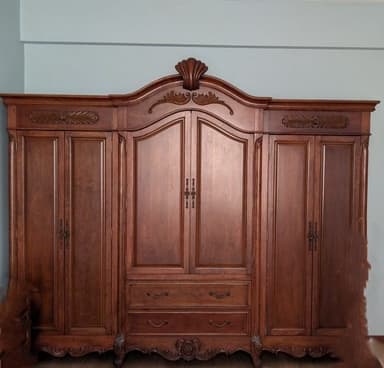 Large, ornate wooden cabinet with multiple doors, drawers, and intricate carvings. — 3D model