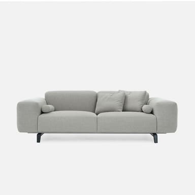 A modern upholstered sofa in a light grey fabric, featuring two main seat and back cushions, with integrated wide armrests and two bolster cushions. The sofa is supported by dark, minimalist metal legs. — 3D model