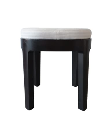A modern round stool featuring a light-colored upholstered cushion atop a dark-stained solid wood frame with four tapered legs. — 3D model