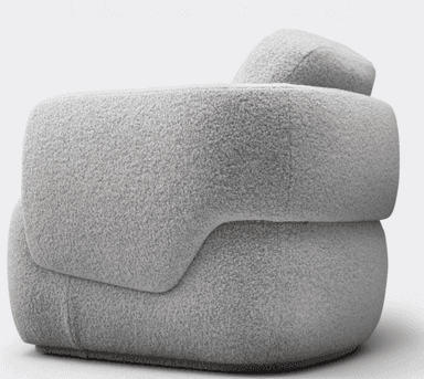 A contemporary, heavily upholstered lounge chair featuring an organic, rounded form. The chair is covered in a plush, textured boucle-like fabric in a light grey or off-white color. It has a low profile with no visible legs, appearing to sit directly on the floor or a very subtle plinth base. The backrest and armrests are integrated into the continuous, fluid shape, emphasizing comfort and softness. — 3D model
