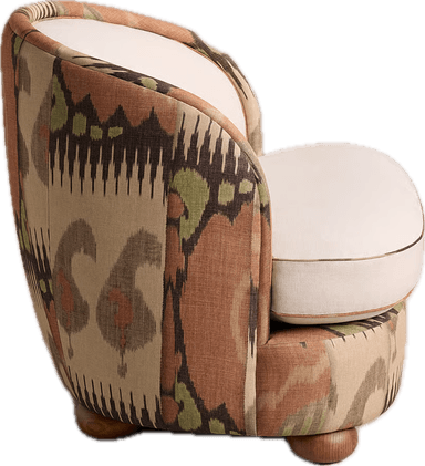 An upholstered barrel accent chair featuring a curved back and armrests, with a separate seat cushion. The chair's back and inner seat are upholstered in a plain cream fabric, while the outer shell and base are covered in a vibrant, multi-colored Ikat pattern. The chair rests on small, rounded wooden bun feet. — 3D model