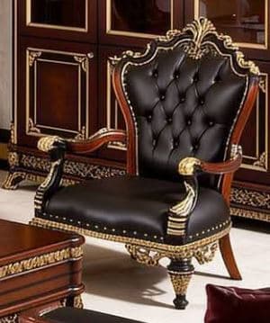 An opulent Baroque-style armchair featuring a dark wood frame richly embellished with gilded carvings. The seat and tufted backrest are upholstered in black leather, accented by a brass nailhead trim along the edges. The chair stands on carved cabriole-style legs with further gilded details. The overall design emphasizes grandeur and intricate craftsmanship. — 3D model