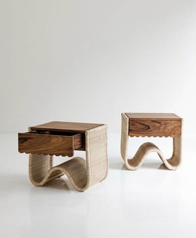 A small, cube-shaped nightstand featuring a wavy, continuous woven base and a single wooden drawer. — 3D model