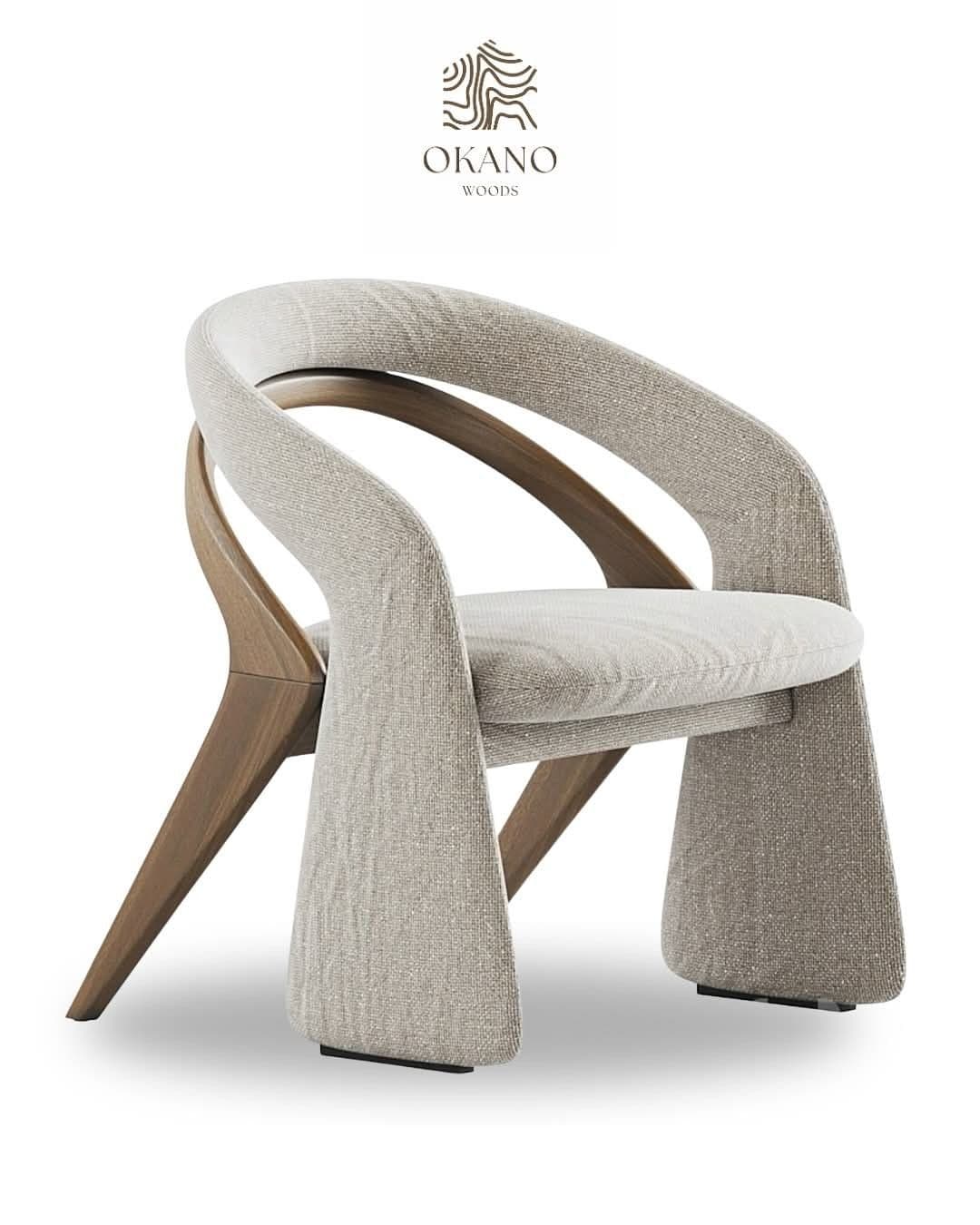A contemporary armchair featuring a distinctive sculptural design. The seat and back are fully upholstered in a light beige, textured fabric, providing a seamless and comfortable form. The chair is supported by an exposed, curved wooden frame in a warm brown tone, which elegantly transitions into tapered legs at the rear. The front part of the chair forms two wide, upholstered panels that extend to the floor, creating a unique and stable base. — 3D model
