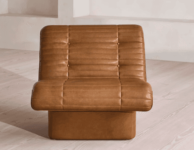 A single-seater armchair upholstered in brown leather with a tufted and channel-stitched design. The chair features a low-profile, boxy base and integrated armrests that flow into the seat and backrest. The upholstery exhibits consistent stitching and button tufting on the backrest and seat cushion. — 3D model