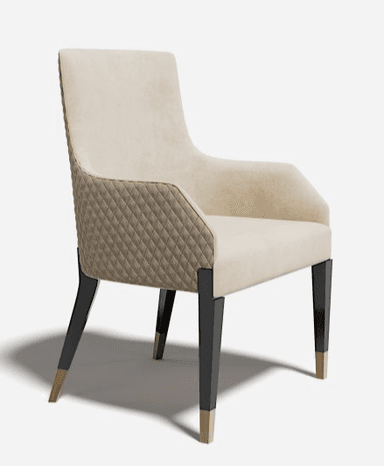An elegant contemporary dining armchair featuring a light-colored upholstered seat and back, with distinctive diamond-quilted panels on the lower exterior back and sides. The chair has integrated armrests that flow seamlessly from the backrest. It is supported by four tapered dark-finished legs, each adorned with a brass-colored metallic cap at the foot. — 3D model