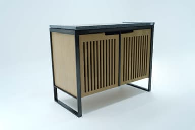 A modern cabinet with a dark, speckled composite countertop, a black metal frame, and two slatted light wood sliding doors. The interior features shelves for storage. The design is minimalist and contemporary, with a strong emphasis on clean lines and mixed materials. — 3D model