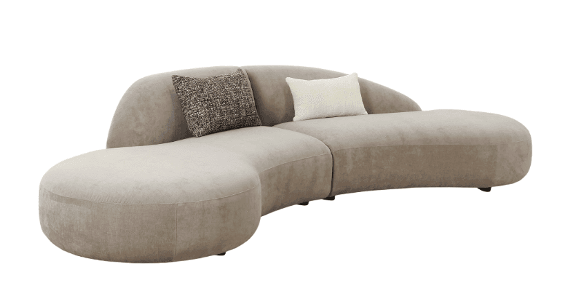 A modular, curved sofa with a low profile and rounded edges. It features a plush, textured upholstery and is accented with two throw pillows. One pillow has a textured, speckled pattern in grey and black, and the other is a plain, cream-colored cushion with a boucle texture. The sofa appears to be composed of two main sections, forming an organic, S-shaped silhouette. It is supported by small, dark feet, barely visible. — 3D model