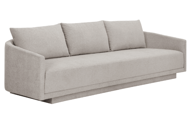 A contemporary three-seater sofa featuring a light, neutral-toned woven fabric upholstery and a distinctive recessed platform base. The sofa includes three separate seat cushions and three loose back cushions, contributing to its clean lines and inviting appearance. Its wide, fully upholstered arms gently curve, seamlessly integrating with the backrest. — 3D model