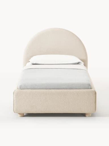A contemporary single bed featuring an upholstered frame in a light neutral fabric, complemented by a distinctive rounded headboard. The bed includes a mattress with white bedding and a light grey duvet or blanket. It stands on four short, light-colored wooden feet, presenting a clean and minimalist aesthetic suitable for modern interiors. — 3D model
