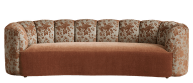 A curved sofa featuring a dual-fabric upholstery design. The seat and lower frame are upholstered in a solid, textured fabric, while the backrest and arms are covered in a fabric with a floral pattern. The backrest is segmented, creating a fluted effect along its length. — 3D model