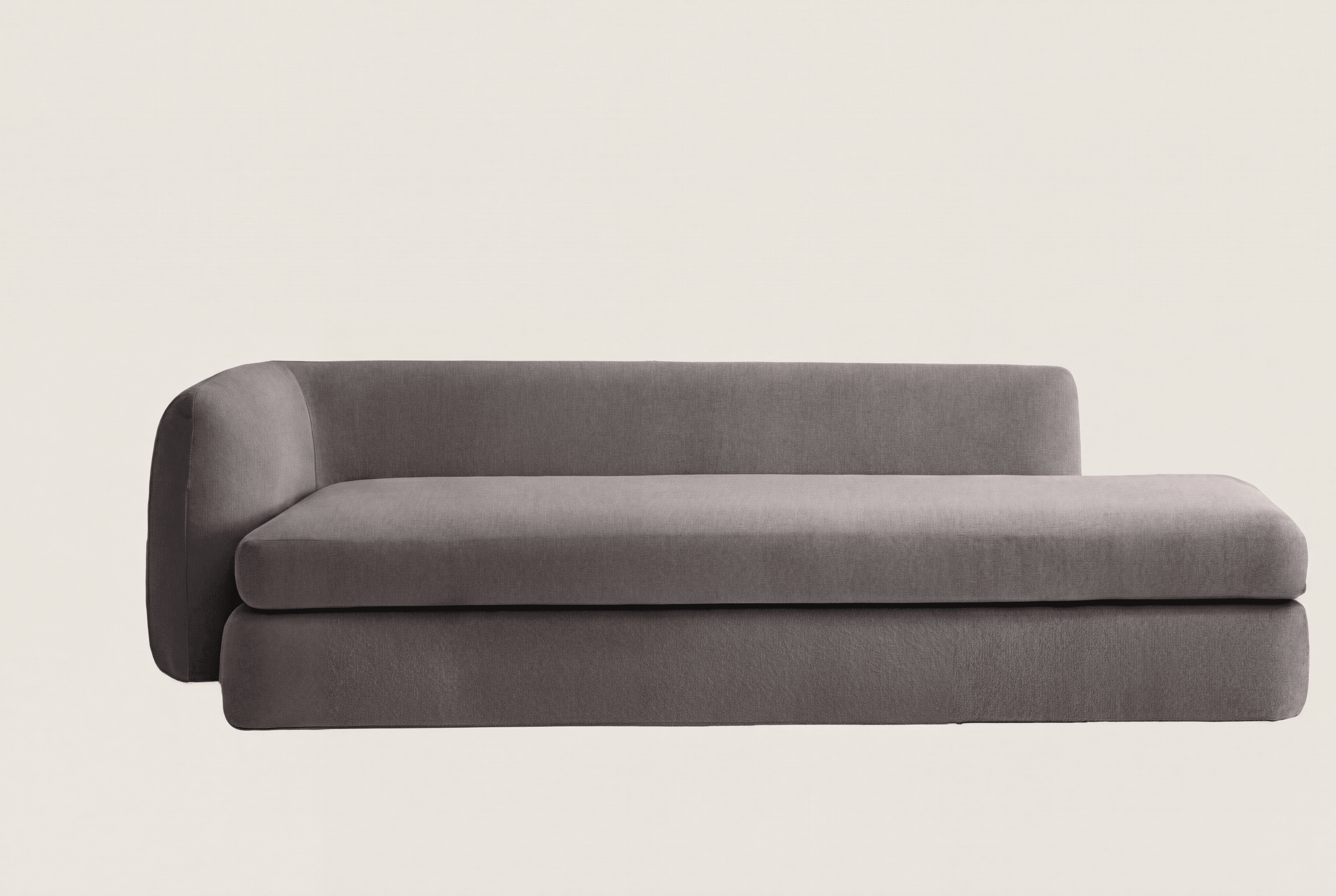 A modern gray upholstered chaise lounge, designed as a component of a larger sectional sofa, featuring a rounded left armrest and a low backrest. — 3D model