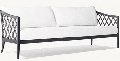 A two-seater sofa with a dark-colored metal frame and white cushions. The frame features an open, geometric lattice design on the armrests and a clean, linear structure for the base and legs. The seat and back are upholstered with plush white cushions. — 3D model