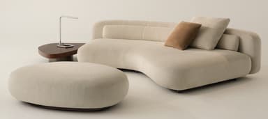 An off-white or cream-colored asymmetrical chaise lounge with soft, organic curves and a low, integrated backrest. It is upholstered in a textured, possibly boucle, fabric and includes two loose cushions, one light-colored and one brown. The base is minimalistic, suggesting a low profile. — 3D model