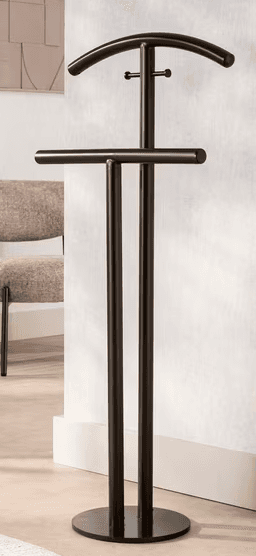 A dark bronze or black metal valet stand featuring a sturdy circular base, a single central vertical post, a curved upper bar designed to hold a jacket or shirt, and a straight horizontal lower bar suitable for trousers or skirts. A small hook is also present on the central post below the upper curved bar. — 3D model