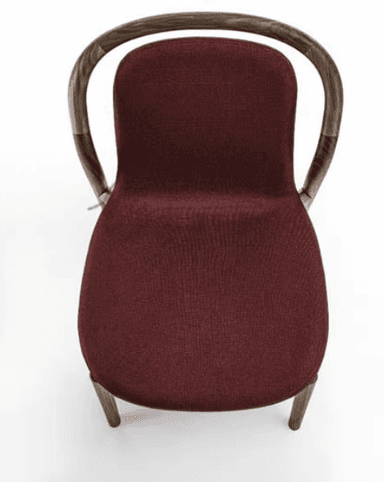 A modern dining chair with a curved wooden frame and a upholstered seat and backrest. The chair features slender, bentwood legs and armrests that merge into the back support. The upholstery is a textured, dark red fabric. — 3D model