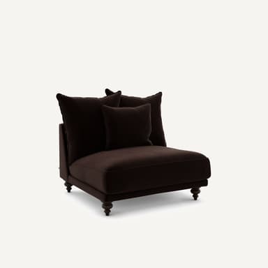 A plush, dark brown armchair with a low profile and three loose back cushions. The armchair features a sturdy frame with four turned wooden legs. The upholstery appears to be a soft fabric, possibly velvet or velour. — 3D model