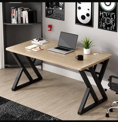 A modern office desk featuring a rectangular desktop with a light wood-grain finish, supported by distinctive black powder-coated steel Z-shaped legs. The desk includes a circular cable management grommet on the top surface for wire organization. — 3D model