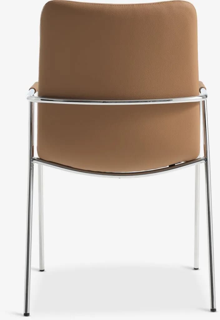 A contemporary armchair featuring a polished tubular chrome frame that forms the legs and integrated armrests. The seat and backrest are upholstered in a smooth, tan-colored material, likely faux leather or a durable fabric. The backrest is gently curved, contributing to the chair's sleek profile. — 3D model
