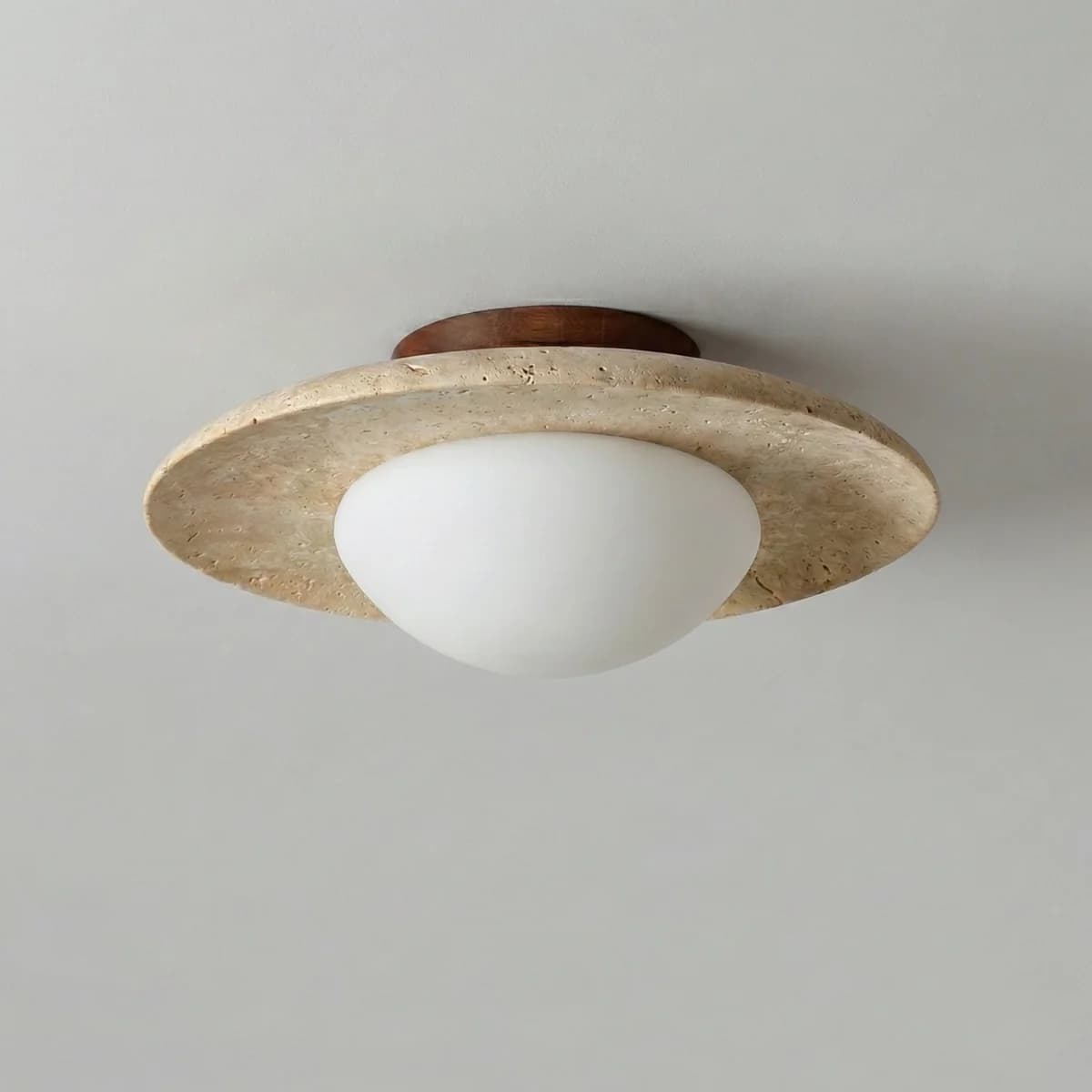 A semi-flush mount ceiling light featuring a natural travertine-like stone disc, a contrasting wooden mounting base, and a spherical white frosted glass diffuser. — 3D model
