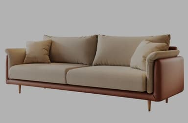 A modern three-seater sofa featuring a two-tone design with light beige fabric for the seat and back cushions, and brown leather-like material for the base and exterior armrests. The sofa has a sleek silhouette with gently rolled armrests and rests on slender, tapered wooden legs. It includes multiple loose back cushions and accent pillows. — 3D model