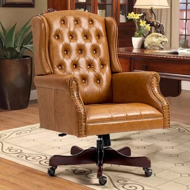 A traditional executive-style office chair featuring a wingback design, upholstered in rich cognac brown leather with deep button tufting on the backrest and individual antique brass nailhead trim. It has a five-star wooden base with casters for mobility and a swivel mechanism. — 3D model