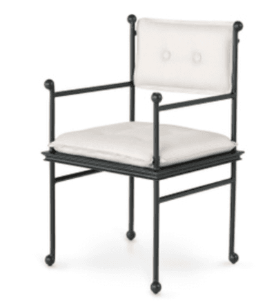 A dark-colored metal frame armchair with light-colored upholstered seat and back cushions. The frame features decorative spherical finials at key connection points and leg bases. — 3D model