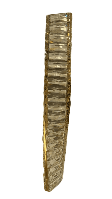 A vertical, wall-mounted lighting fixture featuring a polished gold-toned metal frame intricately embellished with numerous clear, faceted crystal elements. The crystals are arranged in a multi-tiered pattern along the central metal structure, designed to refract and reflect light. A rectangular gold-finished mounting plate is visible at the center. — 3D model