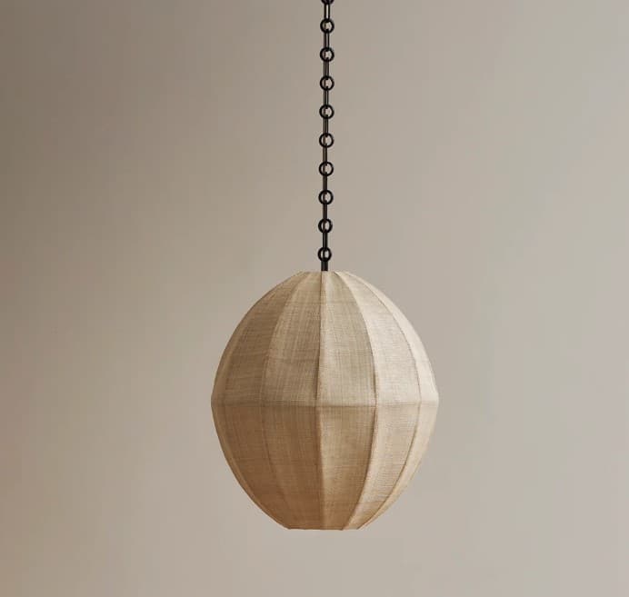 A spherical pendant light featuring a natural-toned, ribbed fabric shade suspended by a black metal chain. The fabric creates a segmented, textured surface around the globe form. — 3D model