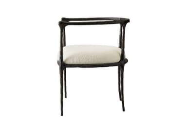 An armchair featuring a dark, heavily textured, and organically shaped cast metal frame paired with a light-colored, upholstered seat cushion. — 3D model