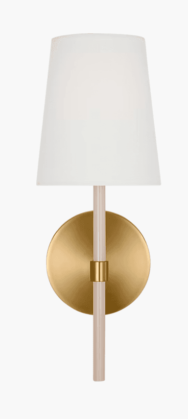 A modern wall sconce featuring a circular brass wall plate, an extending brass arm, and a vertical light-colored acrylic rod from which a white tapered fabric shade is suspended. The brass components have a brushed or satin finish, contributing to a contemporary aesthetic. — 3D model