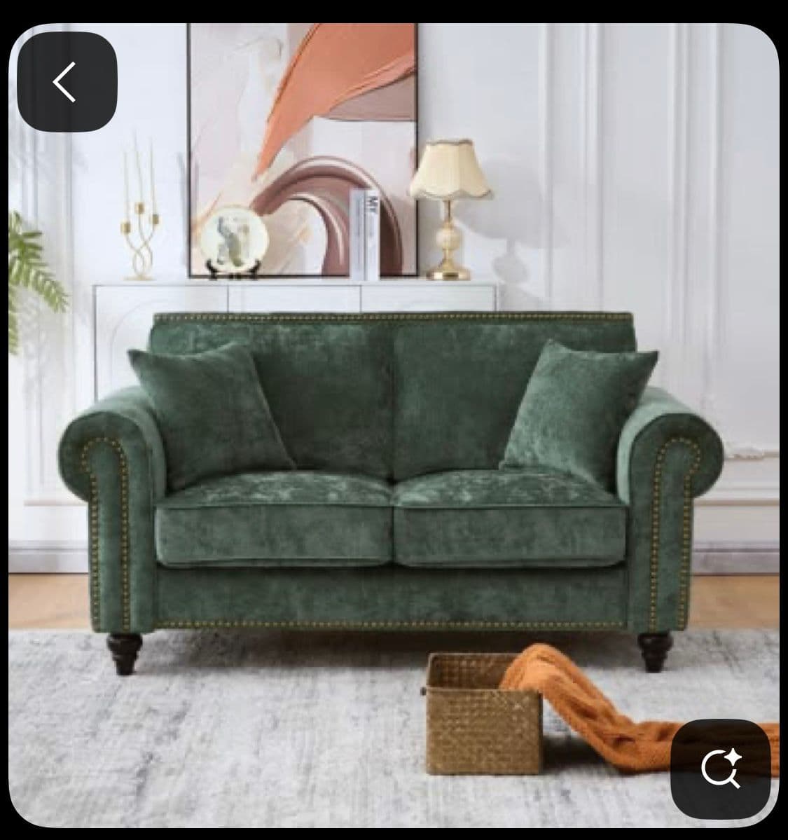 A two-seater sofa with plush cushioning and rolled arms, upholstered in a textured green fabric. The sofa features decorative brass nailhead trim along the front and armrests, and is supported by dark-toned wooden legs. — 3D model