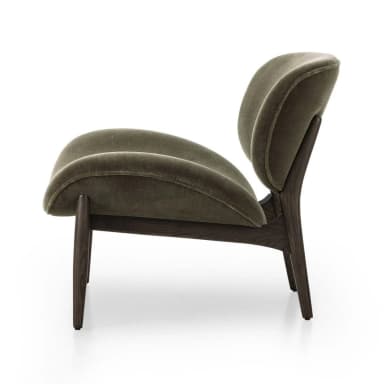A contemporary armchair with a distinctive organic shape, featuring a high, enveloping backrest and a curved, molded seat and armrest. The chair is supported by a wooden base with four splayed legs. — 3D model