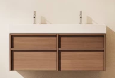 A modern wall-mounted double bathroom vanity featuring a light wood-grain cabinet, a white integrated countertop with two sinks, and two contemporary brushed metal single-handle faucets. The cabinet has four drawers arranged in two columns, each appearing handleless for a sleek aesthetic. — 3D model