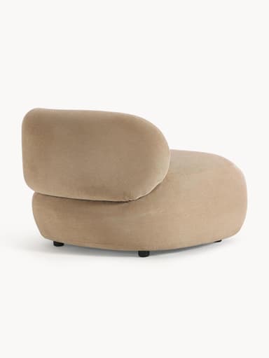 A contemporary armchair with a rounded, organic silhouette. It features a low profile with a deep seat and a single, curved armrest that seamlessly integrates into the backrest. The upholstery appears to be a soft, textured fabric. — 3D model