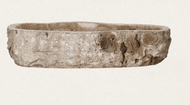 A unique vessel sink carved from a single piece of natural stone, likely travertine or onyx, featuring irregular, organic edges that mimic its raw geological form. The interior basin is smoothly polished to a functional finish, showcasing the material's intricate veining and banding in earthy tones of beige, cream, and brown. A central drain hole is present at the bottom of the basin, designed for standard plumbing. The exterior retains a rough, natural texture, highlighting the stone's origin and natural beauty. This sink is designed to sit atop a vanity or countertop, creating a focal point with its artisanal and natural aesthetic. — 3D model