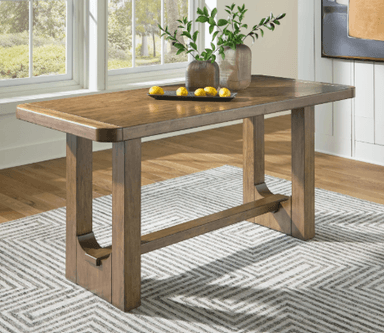 A rectangular wooden bench, rendered on a clean white background, viewed from a high angle. It features a solid, medium-brown wood top with rounded corners and a subtle grooved detail along its perimeter. The robust base consists of two H-shaped leg structures, each comprising two vertical supports connected by a horizontal stretcher. Curved wooden elements are integrated between the vertical legs and the stretcher, adding a design accent. — 3D model